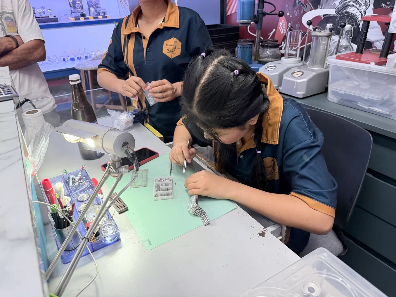 Technician with tweezers